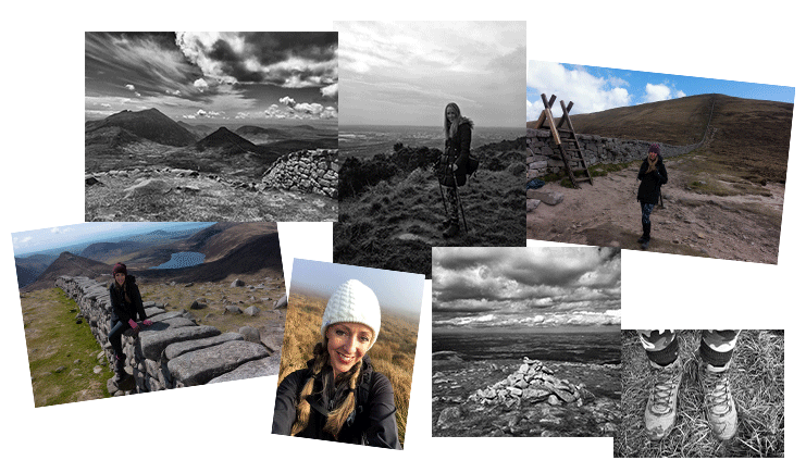 black and white view from summit, cairn, walking boots, stile