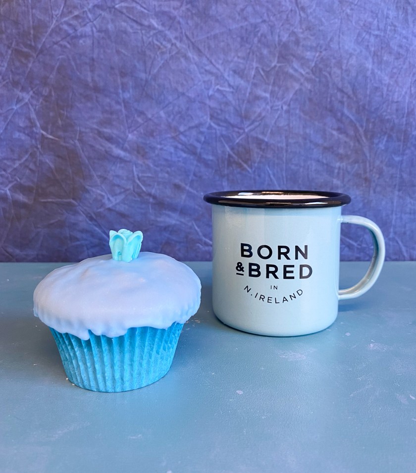 Blue bun with Born & Bred Belfast mug